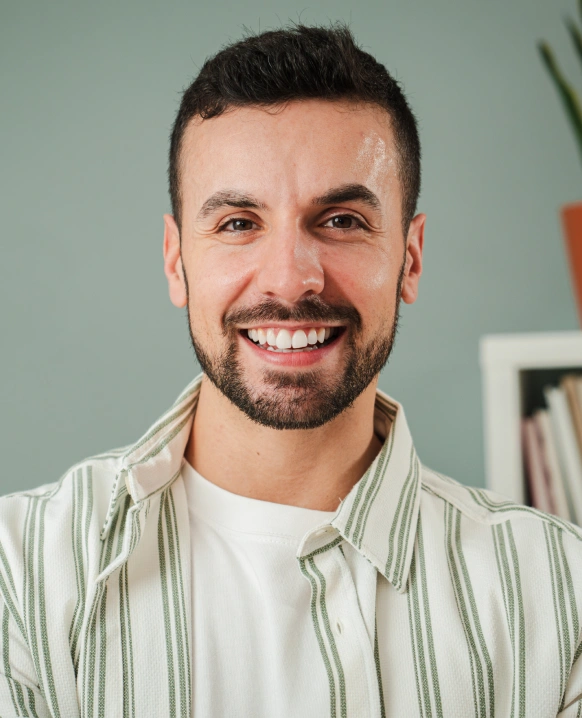 Man smiling after bite adjustment treatment for jaw alignment