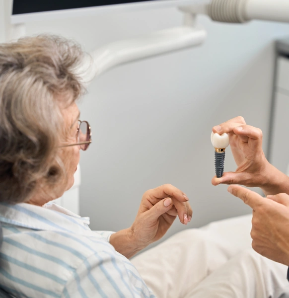 Close up of dental implant model shown during patient consultation