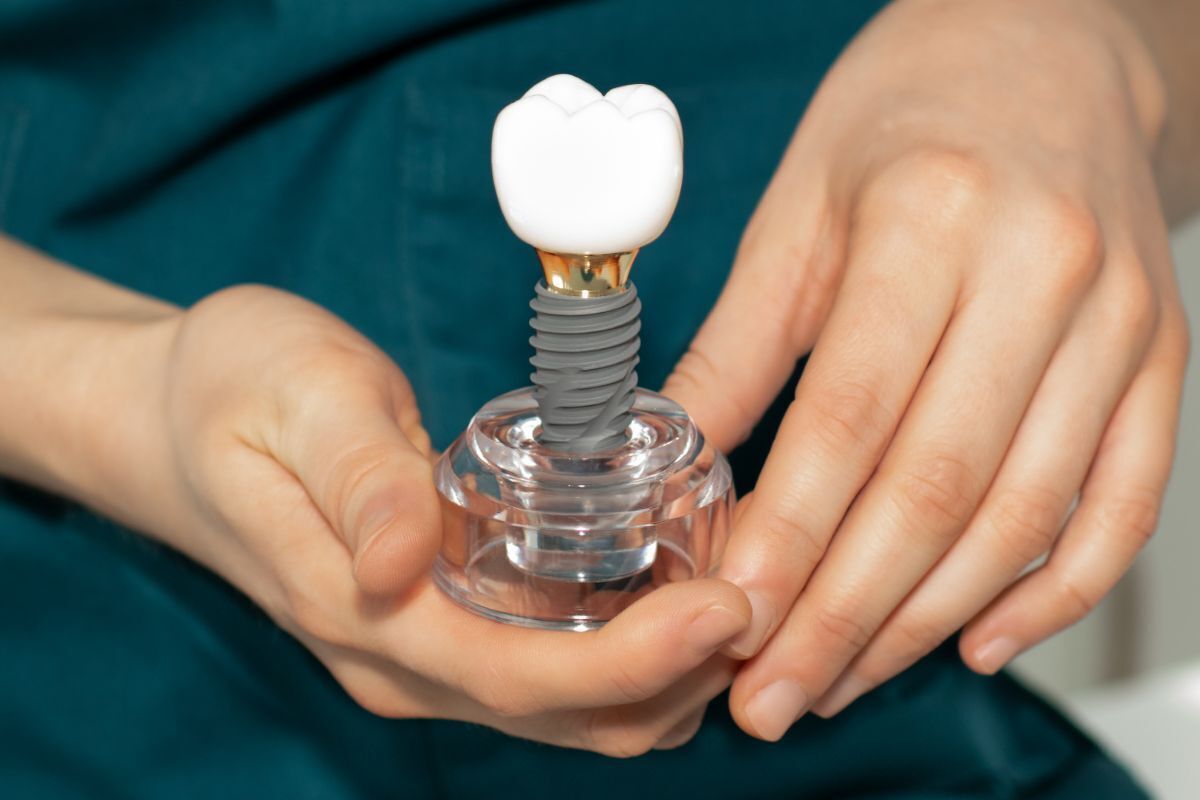 Virginia Beach periodontist discussing dental implants with patient